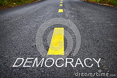 Democracy word on asphalt road Stock Photo