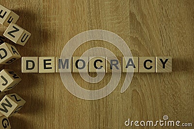 Democracy word from wooden blocks Stock Photo