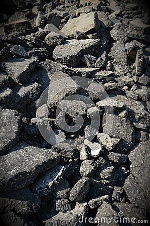 Demolished bumpy broken asphalt pieces Stock Photo