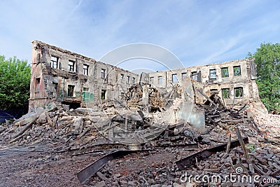 Demolition of an abandoned residential stone two-story house. Stock Photo