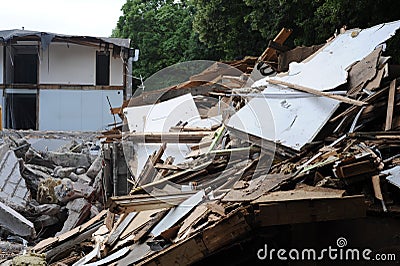 Demolition of a building in deconstruction site with debris, remains and ruined walls Stock Photo