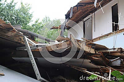 Demolition of a building in deconstruction site with debris, remains and ruined walls Stock Photo