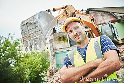 Demolition construction work. Worker at building site Stock Photo