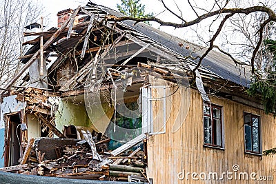 Demolition of an old two-story wooden house Stock Photo