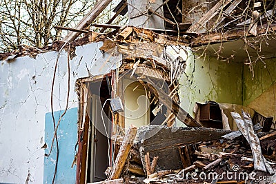 Demolition of an old two-story wooden house Stock Photo