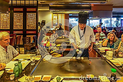 Demonstration of food preparation in a Japanese restaurant Editorial Stock Photo