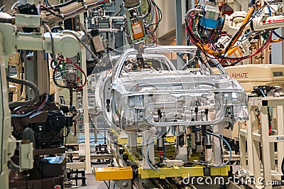 Demonstration of robot welding on a car assembly line Editorial Stock Photo