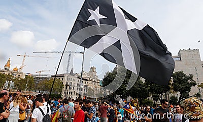 Demonstrators with black estelada independentist catalan flag Editorial Stock Photo