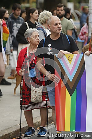 Demonstrators carrying a banner with LGBT colors during the gay pride parade Editorial Stock Photo