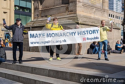 Demonstrators hold a sign saying 'Make Monarchy History' ahead of the King's Coronation in the UK. Editorial Stock Photo