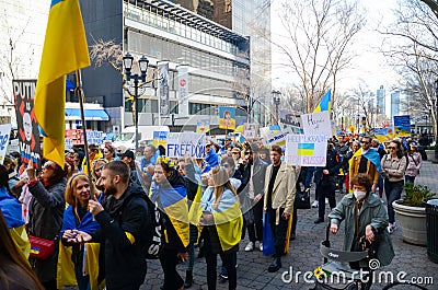 Demonstrators protesting in the streets of New York to show solidarity for Ukraine Editorial Stock Photo