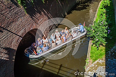 DEN BOSCH, NETHERLANDS - AUGUST 30, 2016: Tourist boat on a canal in Den Bosch, Netherlan Editorial Stock Photo
