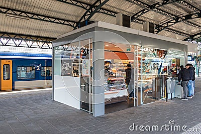 Customers buying sweets at kiosk in Den Bosch train station Editorial Stock Photo