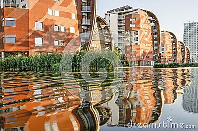 Dutch sail buildings reflecting in pond Editorial Stock Photo