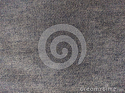 Denim.Abstract Denim Texture. Denim is a sturdy cotton warp-faced textile in which the weft passes under two or more warp threads. Stock Photo