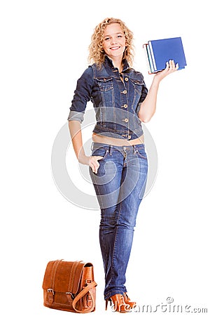 Denim fashion. Full length student girl in blue jeans bag books Stock Photo