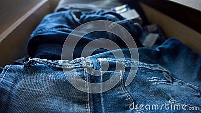 Denim trousers jeans pants drawer folded Stock Photo