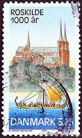 DENMARK - CIRCA 1998: A stamp printed in Denmark shows Roskilde Cathedral and Viking Longship, circa 1998. Editorial Stock Photo