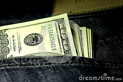 Denominations in denomination of one hundred dollars in a jeans pocket close-up Stock Photo