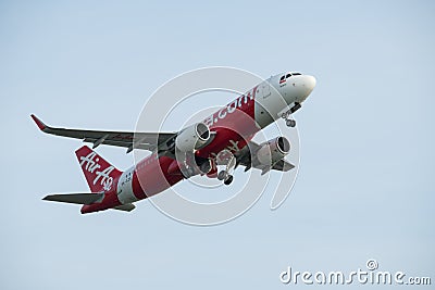 DENPASAR/BALI-APRIL 20 2019: Commercial aircraft belonging to the Asian red water airline are taking off with wheels that are Editorial Stock Photo