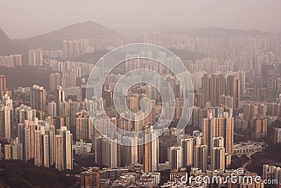 Dense high rise apartments in Kowloon peninsula view from Beacon Hill in the evening, Hong Kong Stock Photo