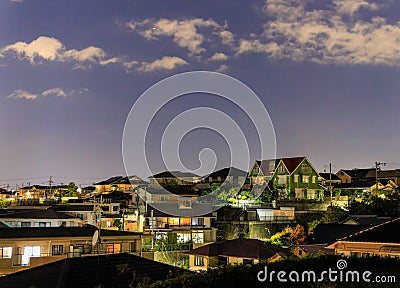 Dense homes in quiet suburban neighborhood at night Stock Photo