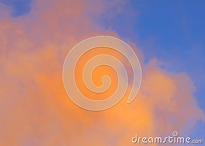 dense orange smoke on blue sky Stock Photo