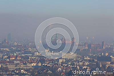 Dense smog over the city, air pollutant, aerial view of the old town Krakow, Wawel Castle, Poland. Stock Photo