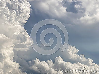 white clouds contrast with grey couds Stock Photo