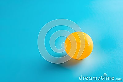 A dent pingpong ball on blue Stock Photo