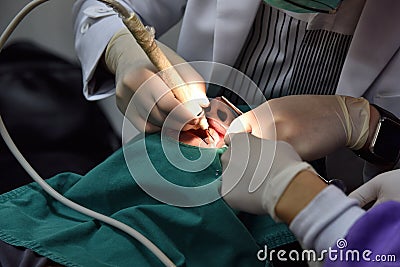 Dental care check up, Dentist examining and doing teeth treatment in dental clinic. Stock Photo