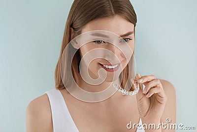 Dental care. Smiling woman using removable clear teeth braces Stock Photo