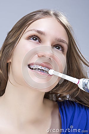 Dental Concept and Ideas. Closeup Portrait of Caucasian Teenage Girl with Teeth Braces Stock Photo