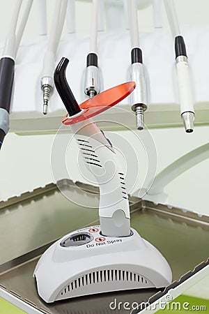 Dental drills and ultraviolet curing light tool. Stock Photo