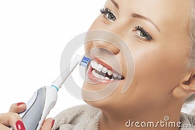 Dental Hygiene Concept:Caucasian Woman Face Closeup Brushing Her Stock Photo