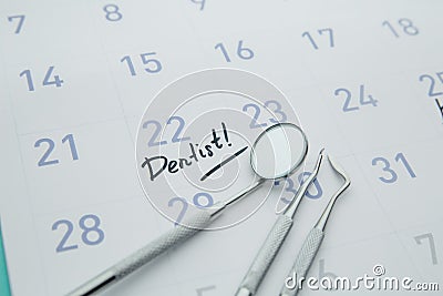 Dental Hygiene and Health concept. Reminder dentist appointment in calendar and professional dental tools Stock Photo