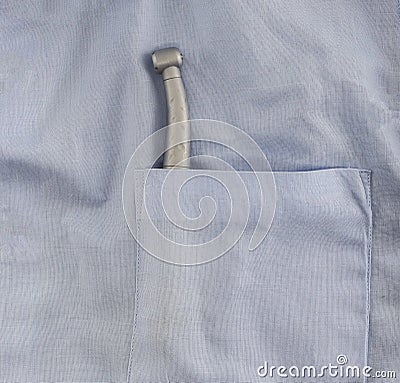 Dental instrument for inspection of the oral cavity in the breast near the blue coat parchment Stock Photo