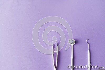 Dental instruments on colorful background with copy spac. Top view. Stock Photo