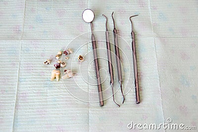 Dental instruments and extracted teeth on a napkin Stock Photo