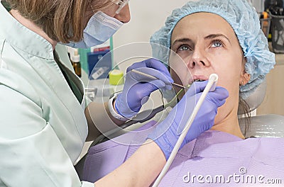 Dental office. Dentist treats teeth to a girl. Stock Photo