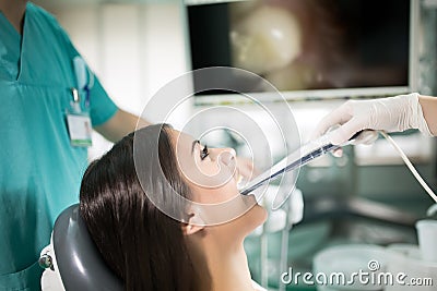 Dental office-specialist tools.intro oral dental camera with live picture of teeth on the monitor.Dental care and dental hygiene Stock Photo