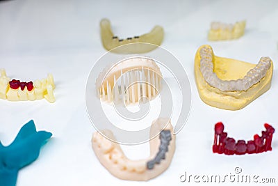 Dental orthodontic tools. Multi-colored device for making a molded tooth. Molding teeth. Stock Photo