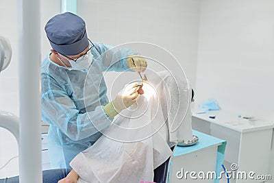 Dental surgery operation in modern dentist clinic Stock Photo