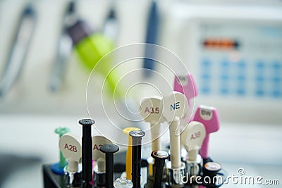 Dental syringes with drug numbers against background of dental chair Stock Photo