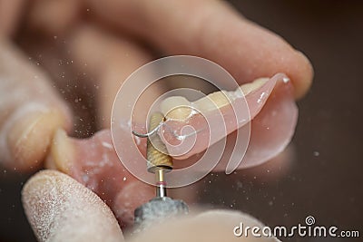 Dental technician make dental prothesis in dental laboratory Stock Photo