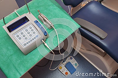 Dental electric handpiece connected to a speed measuring unit Stock Photo