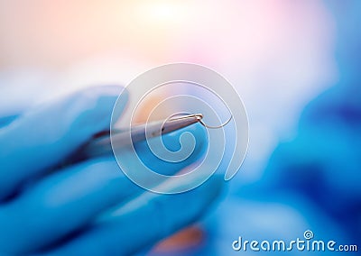 Dental tools on blue background. Preparation for surgery. Stock Photo