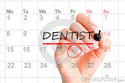 Dentist appointment reminder on calendar planner Stock Photo