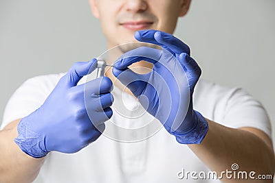 Dentist with dental handpiece Stock Photo