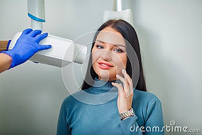 Dentist doctor doing dental treatment teeth patient girl in dental office Stock Photo